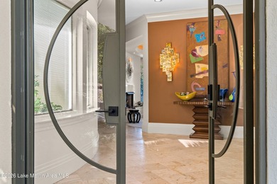 This 5BR Trillium estate redefines lake living. Over 850 ft of - photo 8