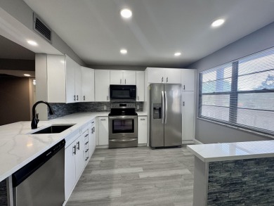 Lake Condo For Sale in Coconut Creek, Florida