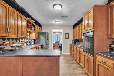 Nestled on a hill, this charming 4-bedroom, 2.5-bath home is - photo 3