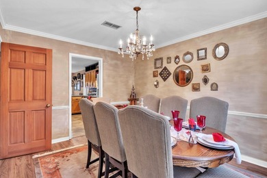 Nestled on a hill, this charming 4-bedroom, 2.5-bath home is - photo 4