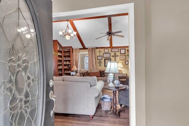 Nestled on a hill, this charming 4-bedroom, 2.5-bath home is - photo 6