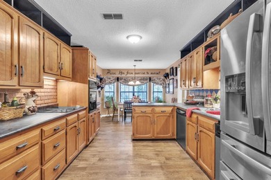Nestled on a hill, this charming 4-bedroom, 2.5-bath home is - photo 10