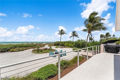 Experience the ultimate in beachfront living at 4577 Waters Edge - photo 4