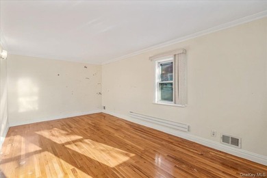 Welcome to Charming Two-Family Home in Prime Oakland Gardens, a - photo 5