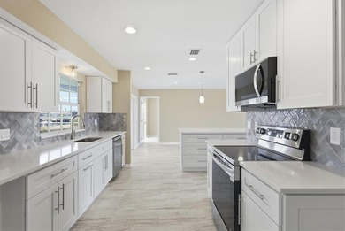 Beautiful waterfront home with spacious newly resurfaced pool - photo 14