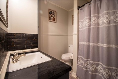 PRICE REDUCED! Welcome to this inviting 3-bedroom, 2-bath brick