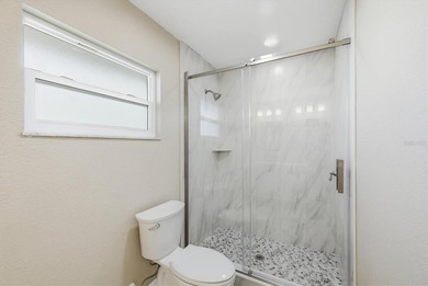 Beautiful waterfront home with spacious newly resurfaced pool - photo 22