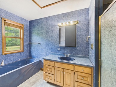 Unlock the potential of this charming lakefront fixer-upper on - photo 37