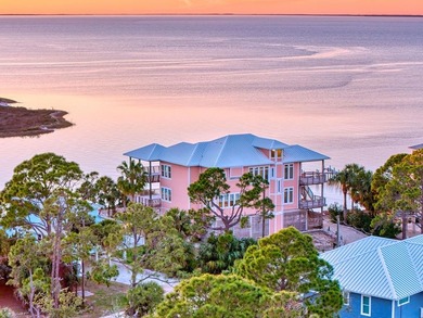 Panoramic sunset views and unmatched waterfront living in this - photo 1