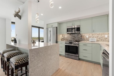 Experience elevated coastal living in this immaculate, fully - photo 13