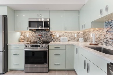 Experience elevated coastal living in this immaculate, fully - photo 18