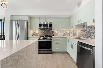 Experience elevated coastal living in this immaculate, fully - photo 20