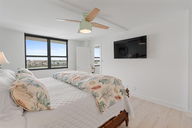 Experience elevated coastal living in this immaculate, fully - photo 25