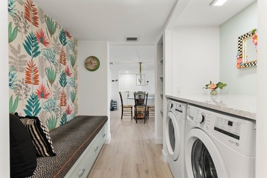 Experience elevated coastal living in this immaculate, fully - photo 36