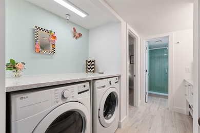 Experience elevated coastal living in this immaculate, fully - photo 40