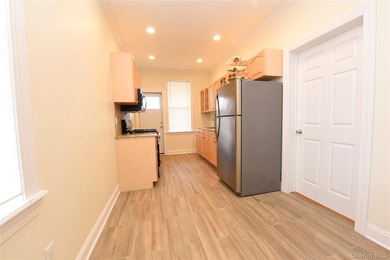Welcome to this beautifully maintained brick two-family home in - photo 11