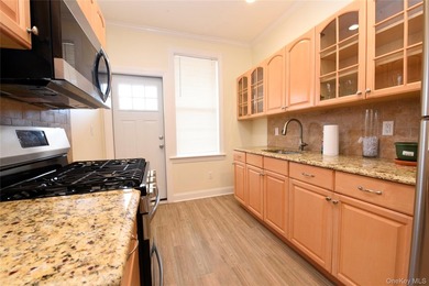 Welcome to this beautifully maintained brick two-family home in - photo 12