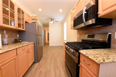 Welcome to this beautifully maintained brick two-family home in - photo 13