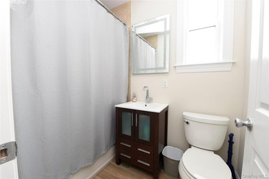 Welcome to this beautifully maintained brick two-family home in - photo 18
