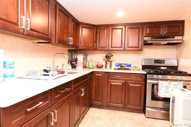 Welcome to this beautifully maintained brick two-family home in - photo 20