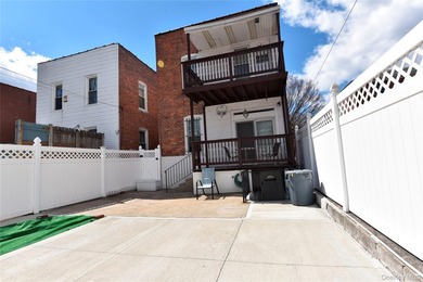 Welcome to this beautifully maintained brick two-family home in - photo 27