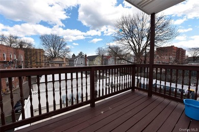 Welcome to this beautifully maintained brick two-family home in - photo 28