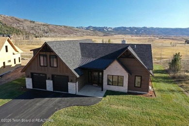 This home perfectly blends luxury with practicality. It offers a - photo 2