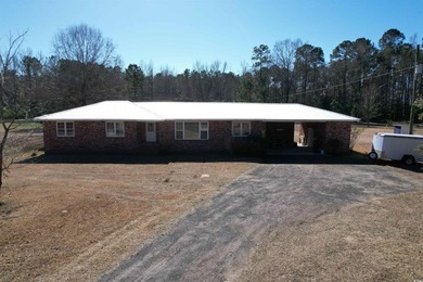 Lovely brick ranch-style home with just over 12 acres! Through - photo 1