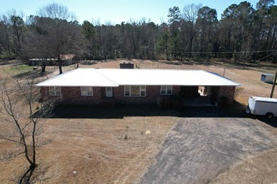 Lovely brick ranch-style home with just over 12 acres! Through - photo 2