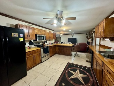 Lovely brick ranch-style home with just over 12 acres! Through - photo 4