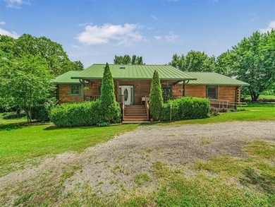 Nestled on just over 2 beautiful acres this custom-built log - photo 1