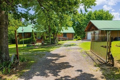 Nestled on just over 2 beautiful acres this custom-built log - photo 2