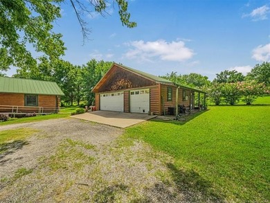 Nestled on just over 2 beautiful acres this custom-built log - photo 3
