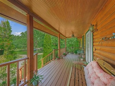 Nestled on just over 2 beautiful acres this custom-built log - photo 4
