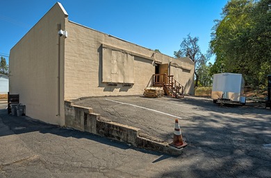 Lot is 30,928 sq ft with 3 buildings. The main building is a two - photo 3
