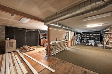 Lot is 30,928 sq ft with 3 buildings. The main building is a two - photo 6