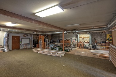 Lot is 30,928 sq ft with 3 buildings. The main building is a two - photo 7