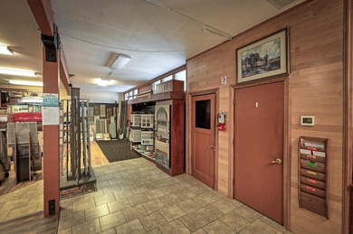 Lot is 30,928 sq ft with 3 buildings. The main building is a two - photo 9