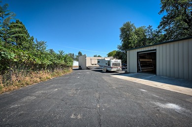 Lot is 30,928 sq ft with 3 buildings. The main building is a two - photo 10