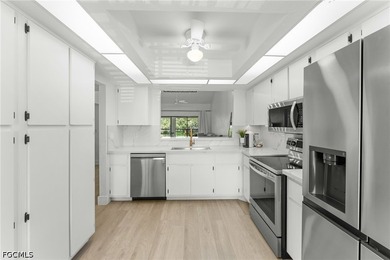 Welcome to this beautifully remodeled second-floor condo in the - photo 9