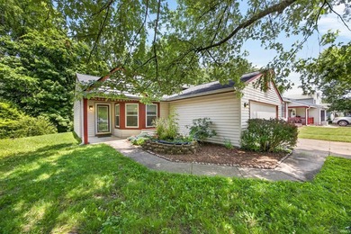 Tucked beneath mature trees on a quiet street, this charming 3 - photo 1