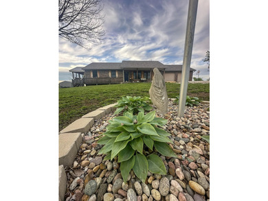 This well-maintained 3-bedroom, 3.5-bath ranch-style home offers - photo 3