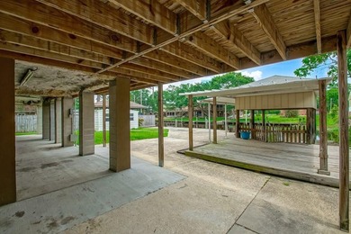 WATERFRONT LIVING AT IT'S BEST. BOAT DOCK AND HOIST IS - photo 32