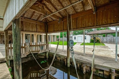WATERFRONT LIVING AT IT'S BEST. BOAT DOCK AND HOIST IS - photo 34