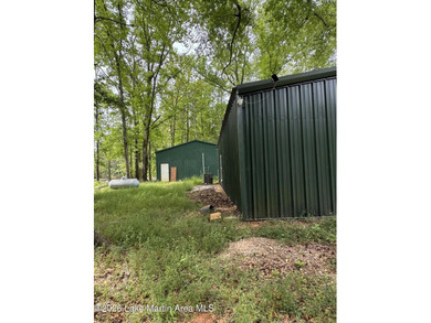 Nestled in a private, wooded setting, this property offers a - photo 2