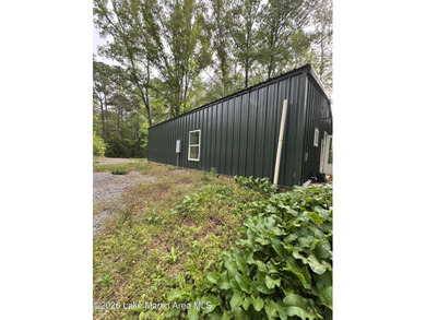 Nestled in a private, wooded setting, this property offers a - photo 3