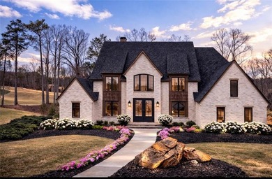 Welcome to 215 Traditions Drive, an exceptional custom luxury