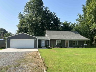 WOW! If you love fishing and riverfront living, this home is for - photo 1