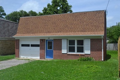 Recently remodeled and move-in ready! This charming brick - photo 1