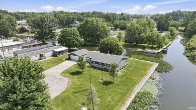 Discover turnkey lake living on Kuhn Lake, part of the - photo 1